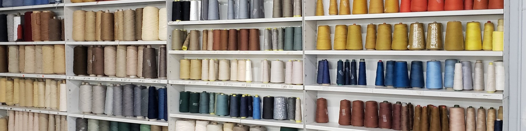 Wide Variety Of Carpet Mending And Serging Materials On A White Shelf